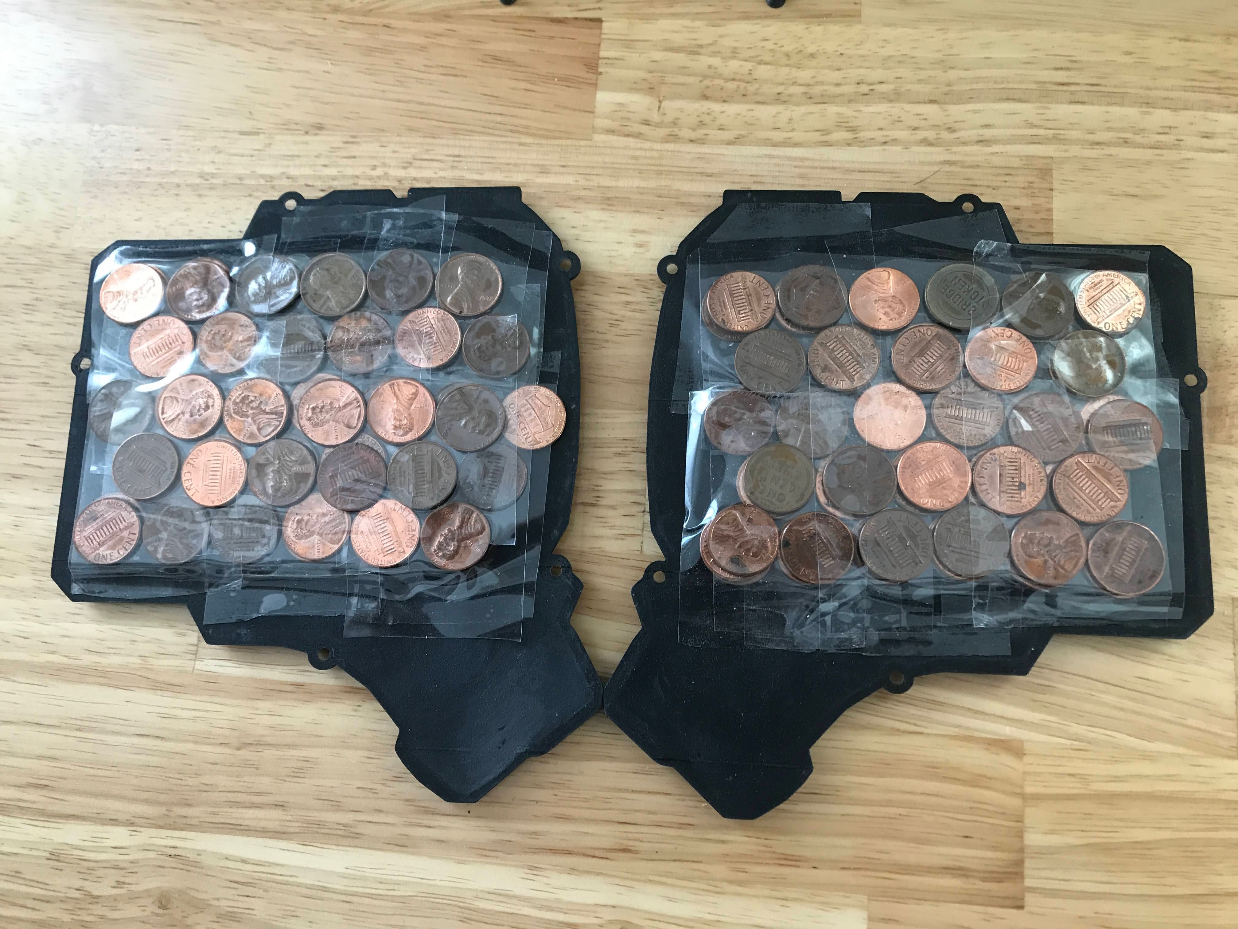 Pennies taped to the bottom of each case half for ballast